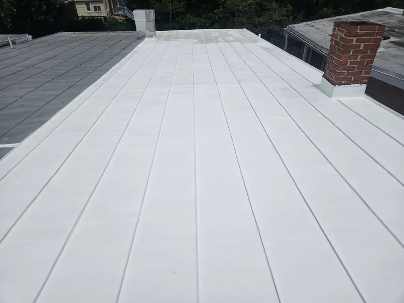 White sloped roof with chimney. 